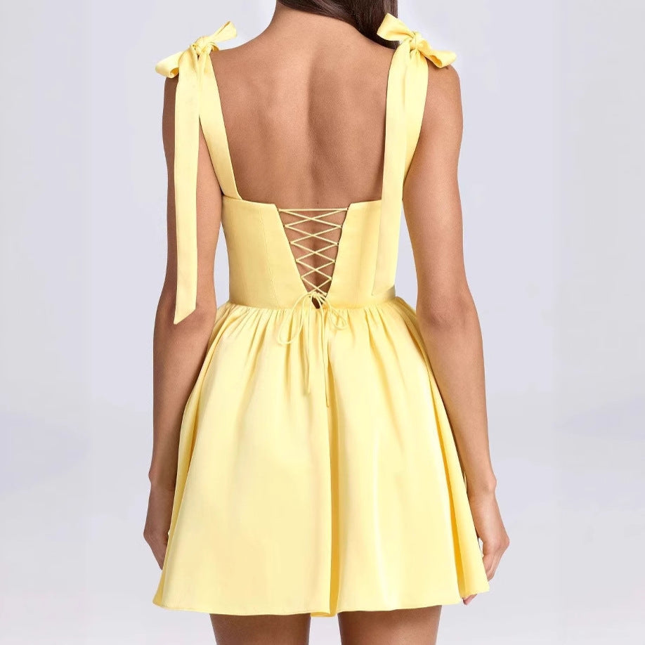 Airy summer dress for women with a pretty back cutout and charming bows Lune London