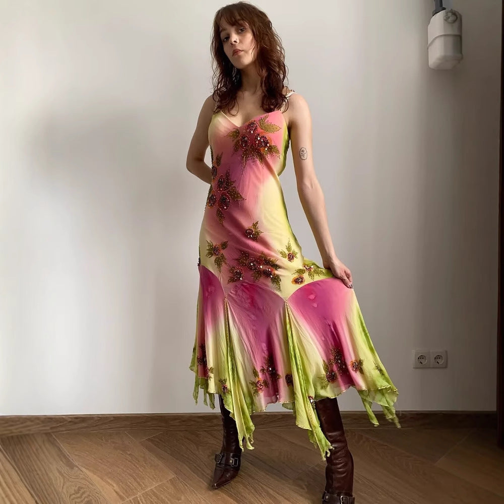 Asymmetrical summer dress for women with a floral design and delicate spaghetti straps Lune London