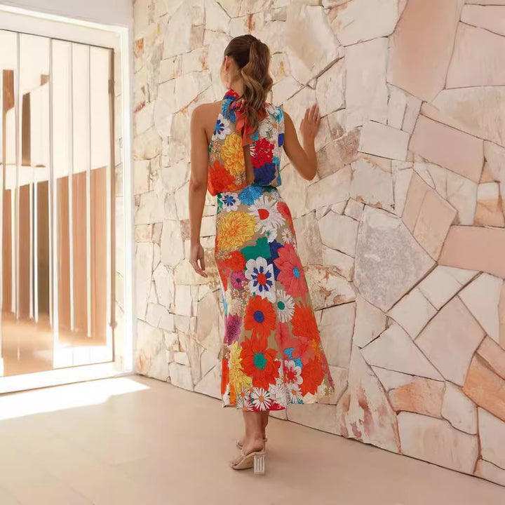 Ladies max dress with creative floral design and playful neckholder