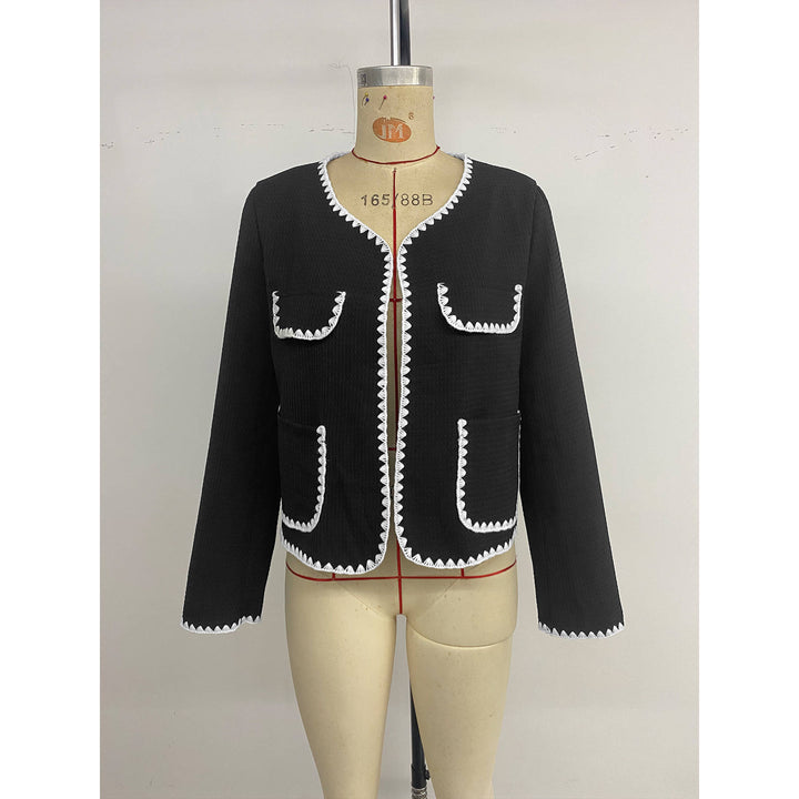 Elegant women's blazer jacket with short sleeves featuring contrasting piping embellishments and Lune London pockets