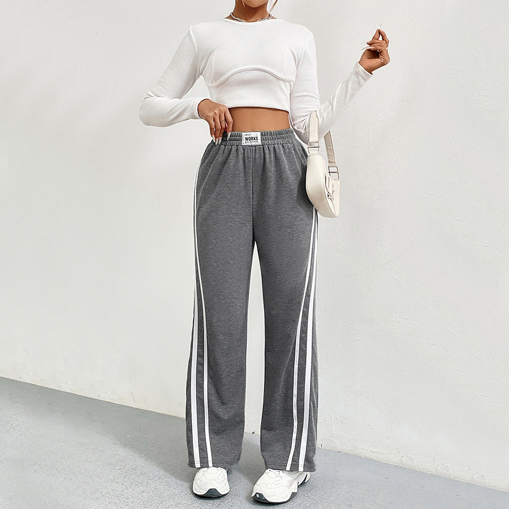 Pantalons de loisirs sportifs pour femmes avec coupe large et rayures contrastées Chic & Stil