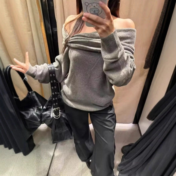 Pull élégant pour femmes avec col châle asymétrique et fermeture décorative Chic & Stil