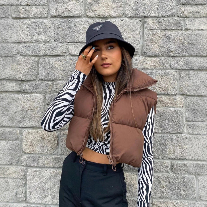Quilted vest for women with high collar and practical pockets Lune London
