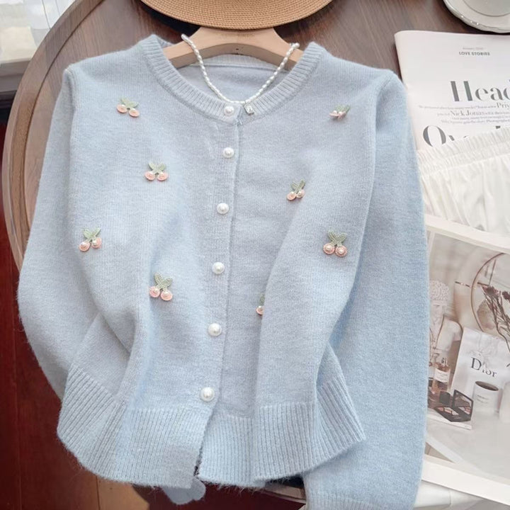 Ladies Elegant Knitted Waistcoat with Chic Floral Applications and Style