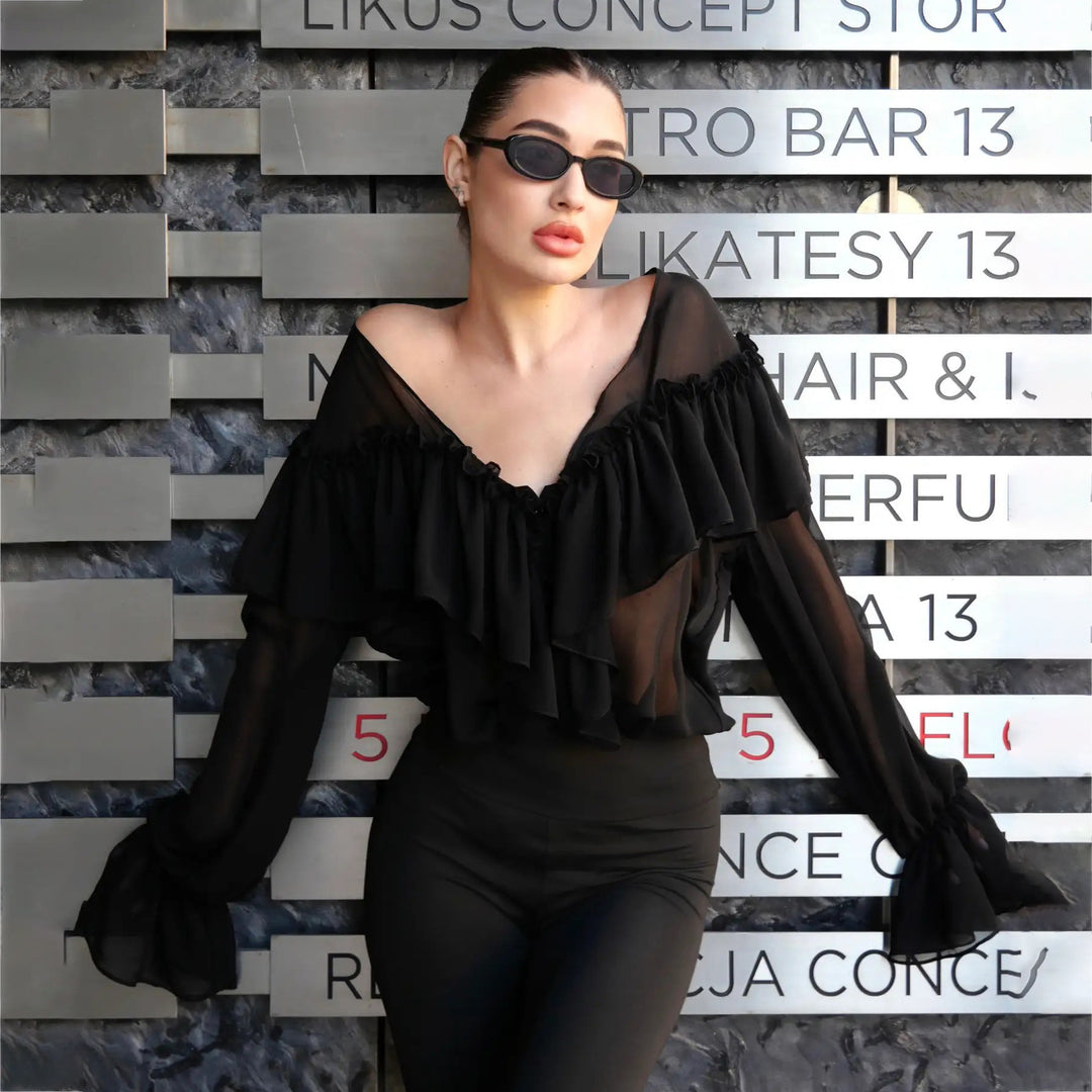 Blouse for women with voluminous ruffle details and an elegant button placket Lune London