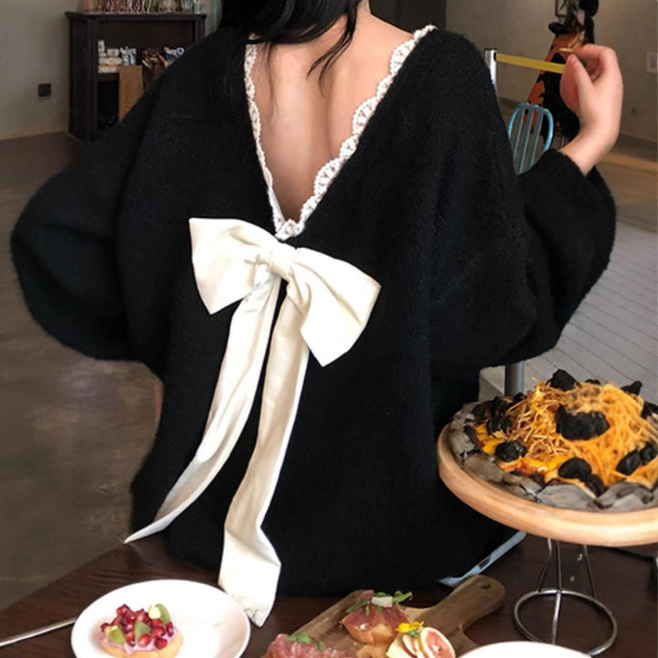 Oversized knit sweater for women with V-neck and delicate lace trim Lune London