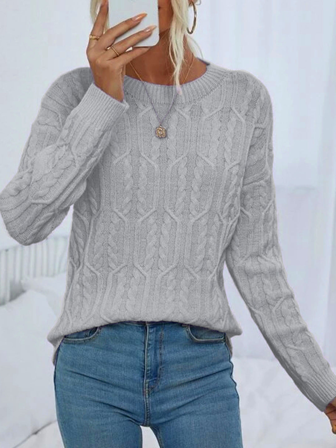 Ladies knit sweater with cable pattern demanding Lune London