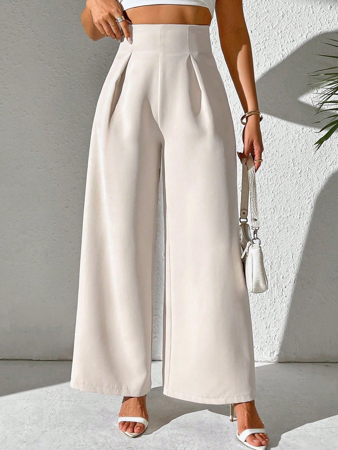 High-waisted wide-leg pants for women with decorative pleats Lune London