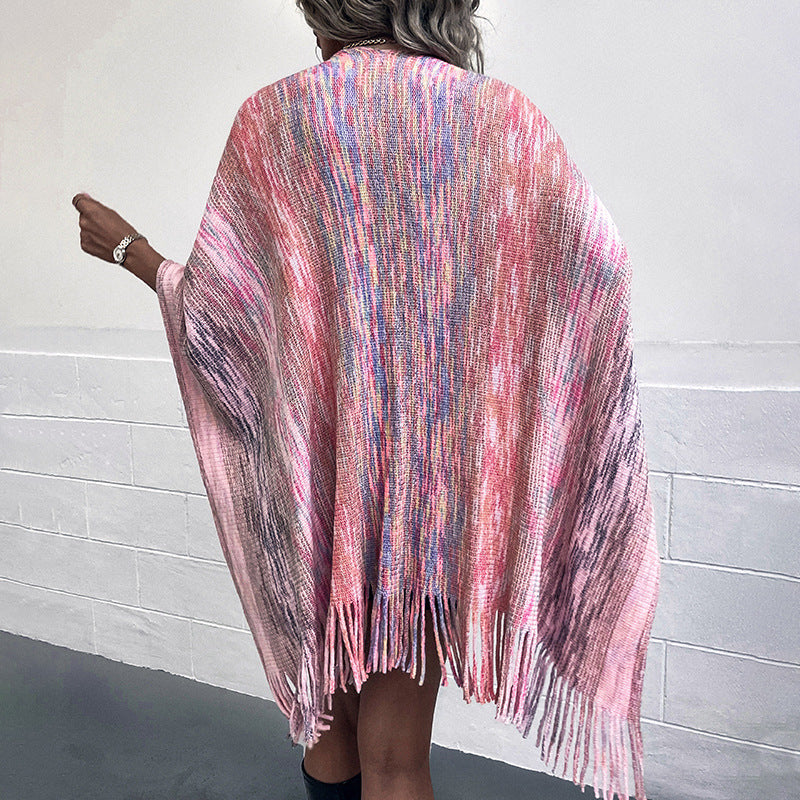 Ladies fashionable poncho with luxurious faux fur trim and creative fringes Lune London