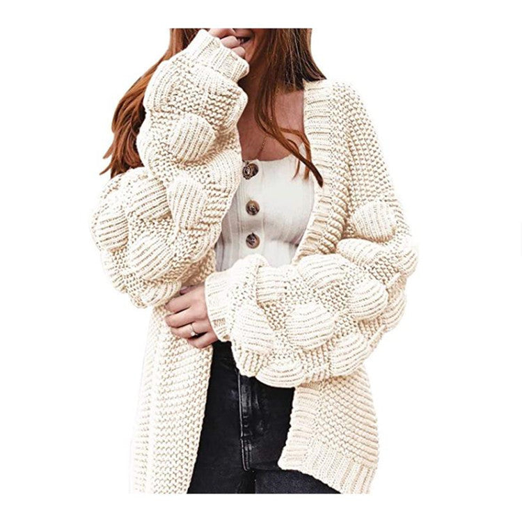 Knitted women's jacket with voluminous puff sleeves and a structured knit look Lune London