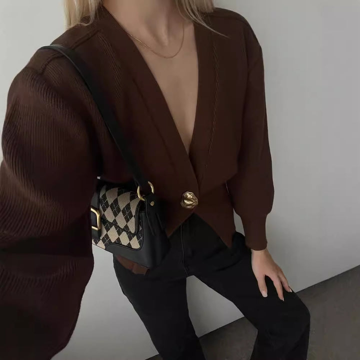 Elegant knitted cardigan for women with a deep V-neck and decorative button Lune London