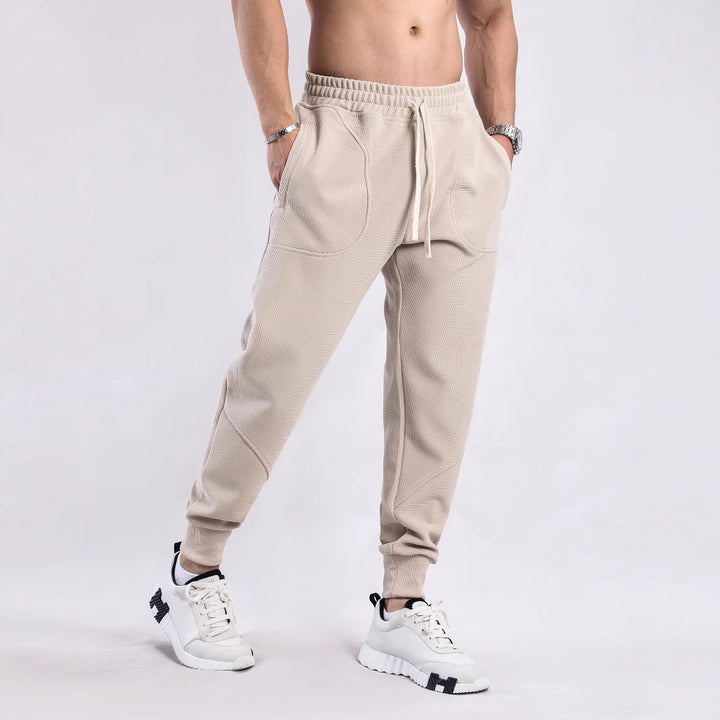 Men's sporty jogger pants with breathable inserts and elastic waistband Lune London