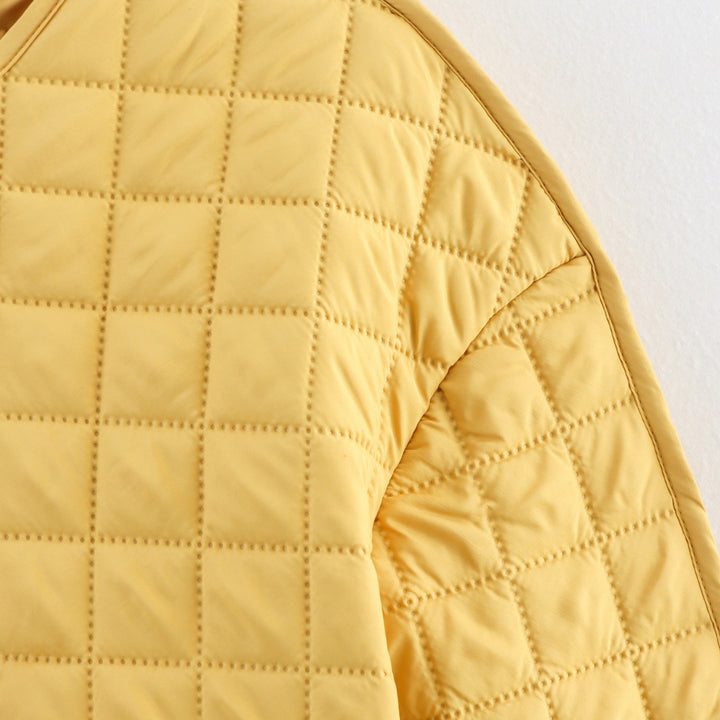 Quilted transition jacket for women with practical pockets Lune London