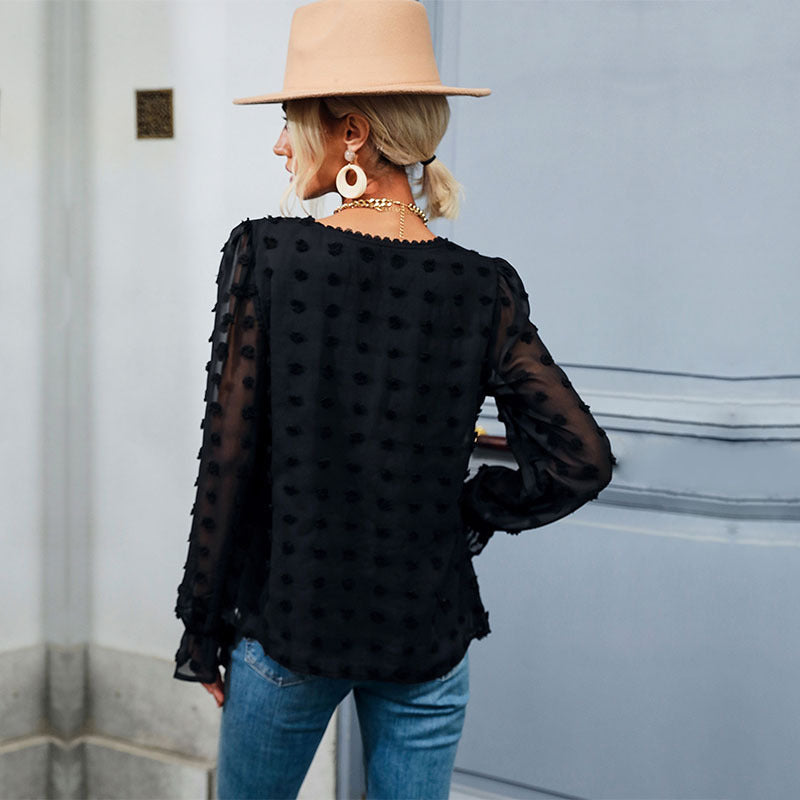 Elegant puff sleeve blouse for women with textured polka dot pattern Lune London