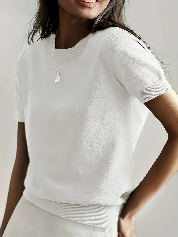 Fine knit sweater for women with a short sleeve silhouette and a soft fluid material Elegance and style