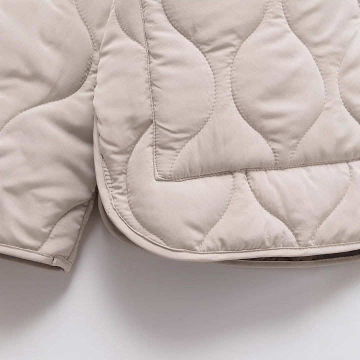 Veste de transition matelassée pour femmes avec poches latérales et coupe moderne Chic & Stil