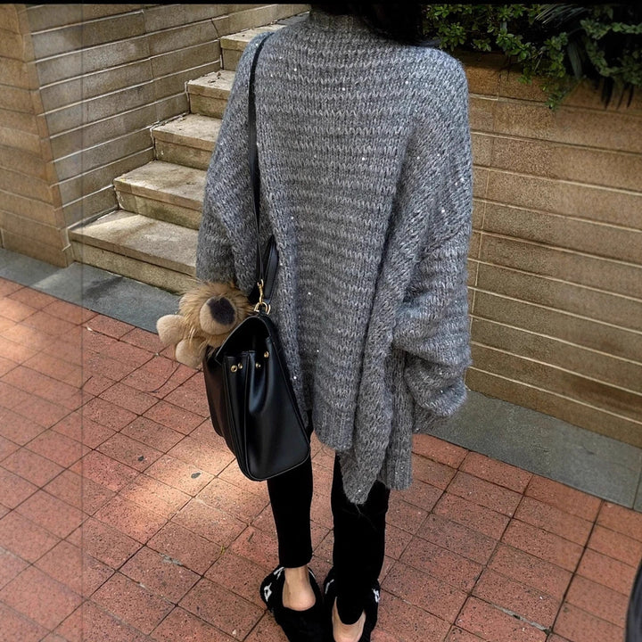 Knitted jacket for women with voluminous sleeves and a unique mesh structure Lune London