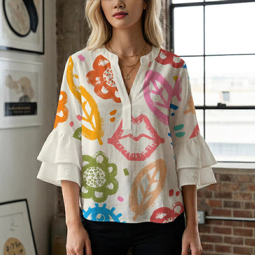 Women’s blouse with voluminous ruffled sleeves and floral pattern Lune London