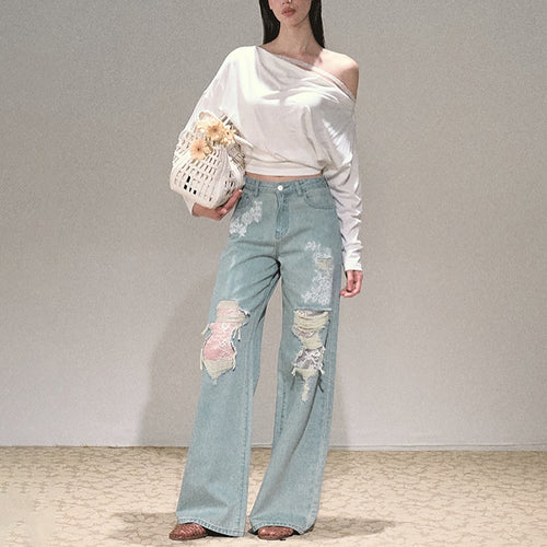 Women's wide cut jeans with individual destroyed details and floral print Lune London