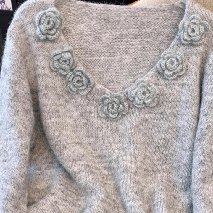 Pull en maille pour femmes avec accents floraux Chic & Stil