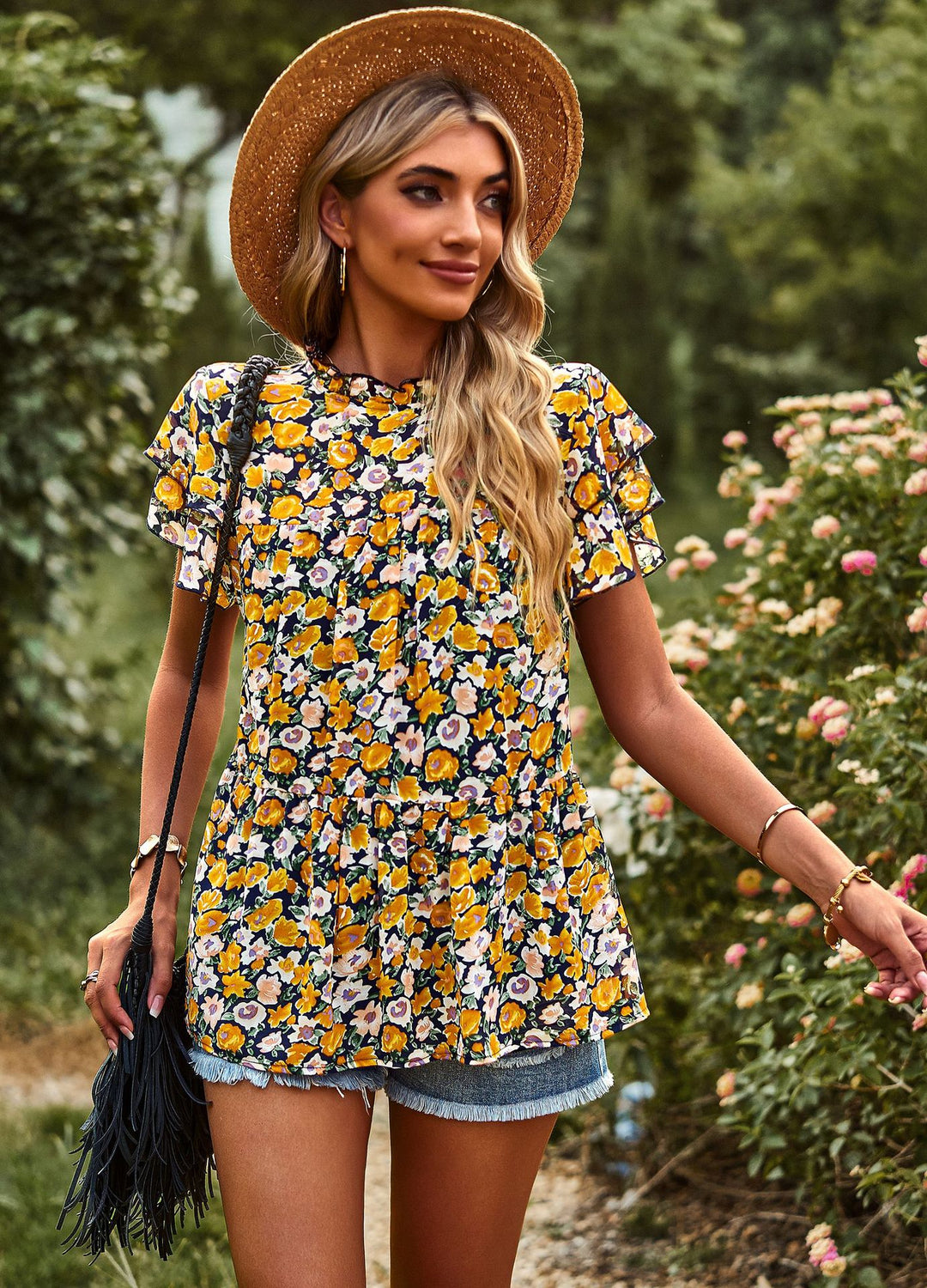 Dynamic women's blouse with ruffled details and floral design Lune London