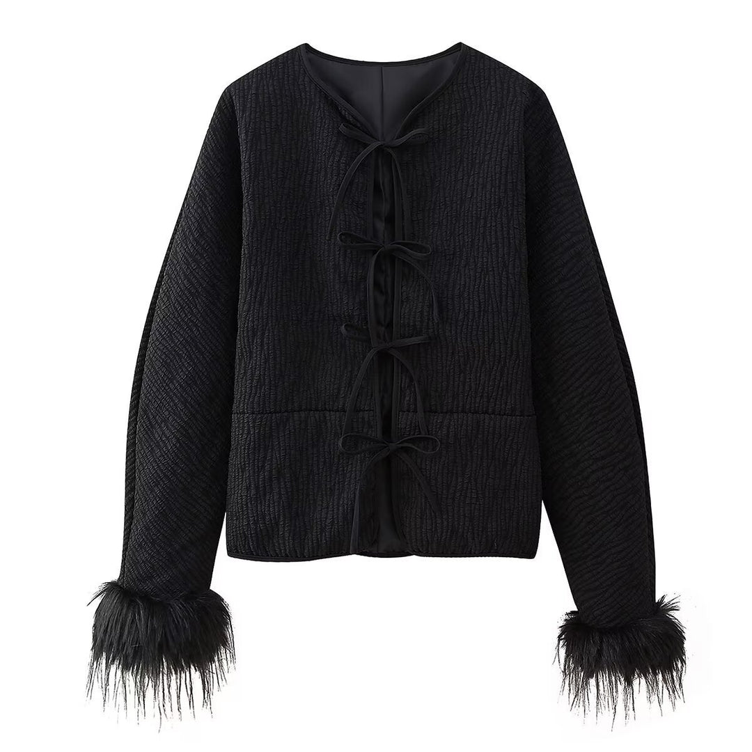 Fashion quilted jacket for women with a refined tied belt and elegant fox fur sleeves Lune London