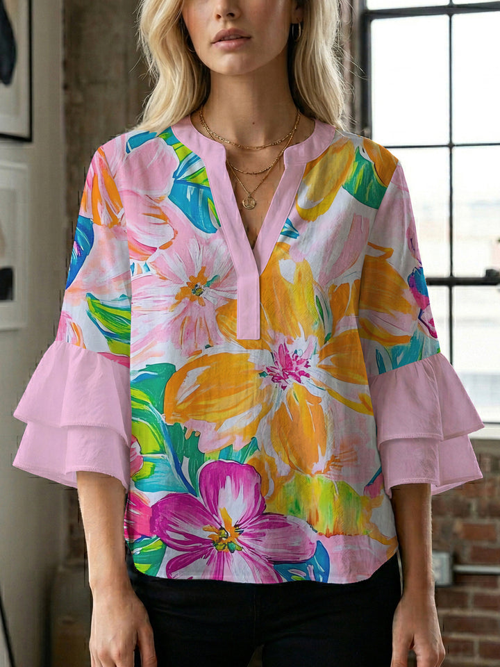 Women’s blouse with voluminous ruffled sleeves and floral pattern Lune London