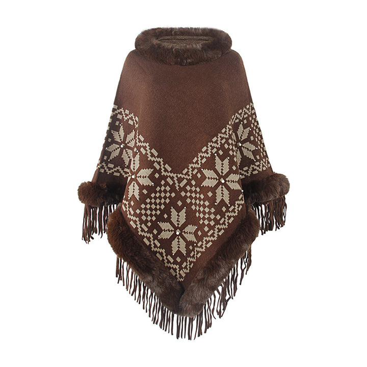 Elegant women's poncho with decorative fringe design and faux fur trim Lune London