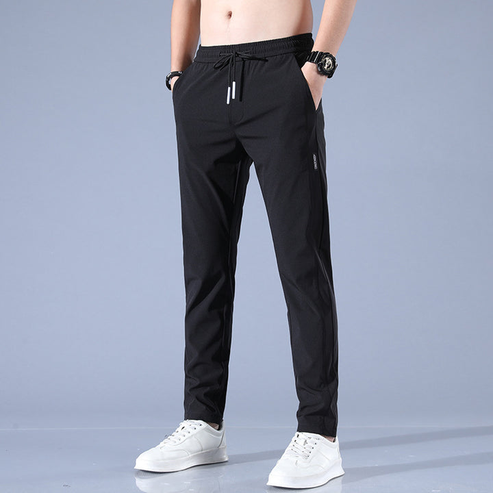 Sports jogger pants for men with elastic waist and practical zip pockets Lune London