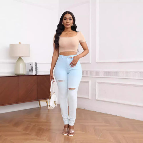 High-waisted women's fitted jeans with stylish ripped details Lune London