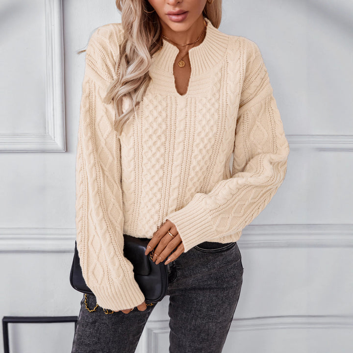 Fashionable women's knitted sweater with a unique cable design and a chic round neck. Lune London