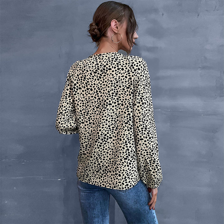Top femme avec des détails volantés et imprimé animal Chic & Stil