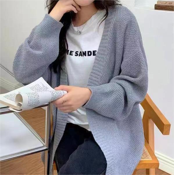 Ladies chunky knit cardigan with a loose fit and long sleeves Lune London