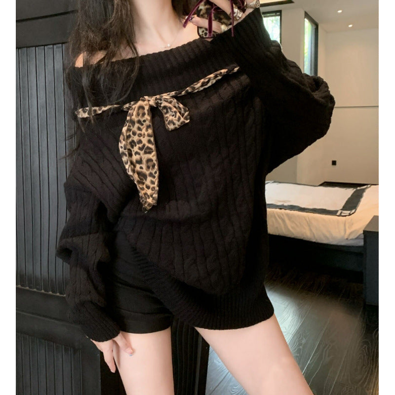 Chunky knit sweater for women with off-the-shoulder design and playful bow accent Lune London