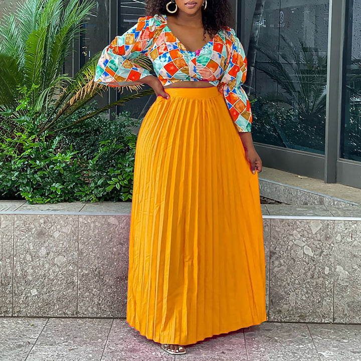 Pleated combined dress for ladies with a colorful top and a flared skirt Lune London