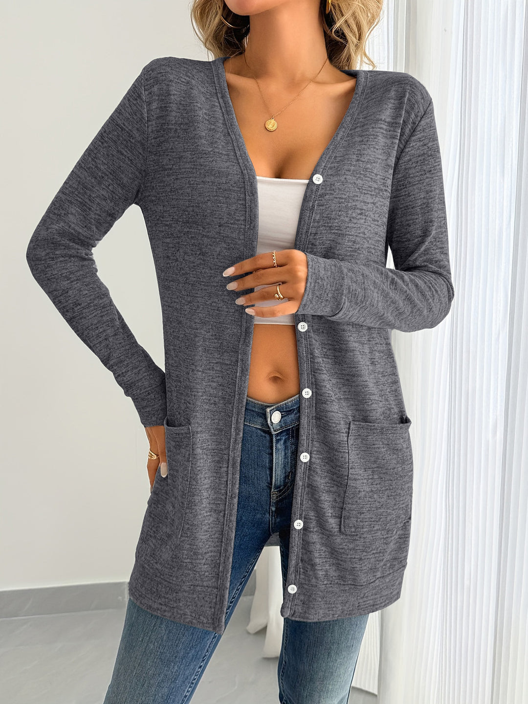 Ladies long sleeve cardigan with practical pockets and button placket Lune London