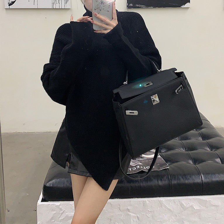 Knitted sweater for women with asymmetric cut and high collar Lune London