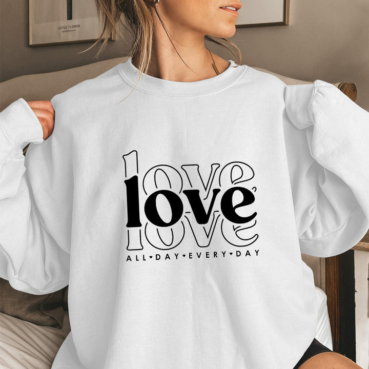 Sweat-shirt pour femmes avec des manches volumineuses et imprimé moderne "love" Chic & Stil