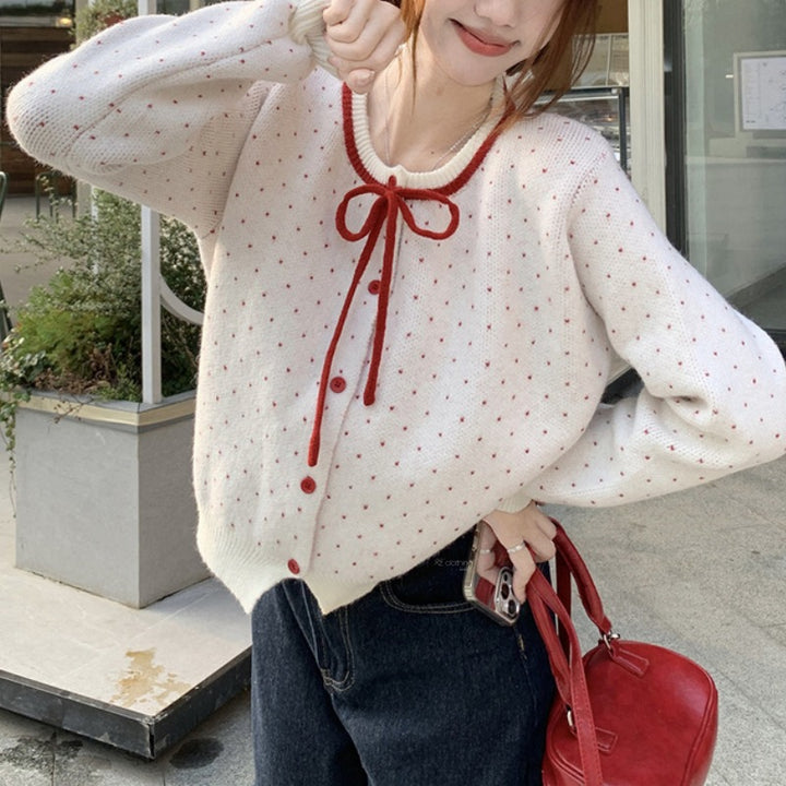 Cardigan féminin avec des pois et un nœud Chic & Stil