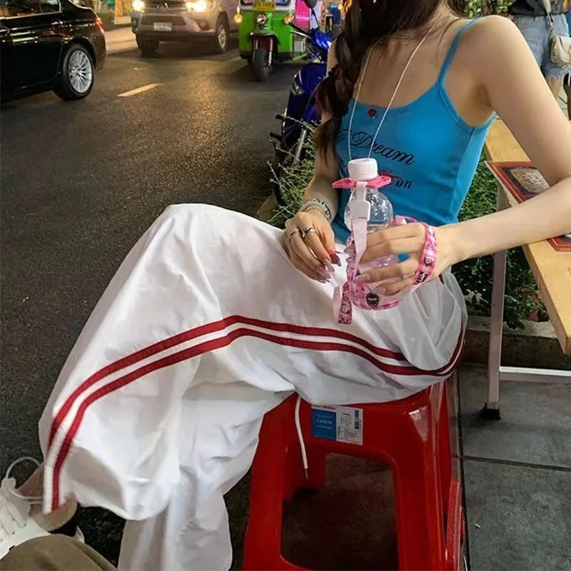 Women's casual sports pants with side stripes and elastic waistband