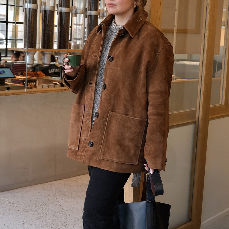 Elegant suede jacket for women with generous pockets and chic button details