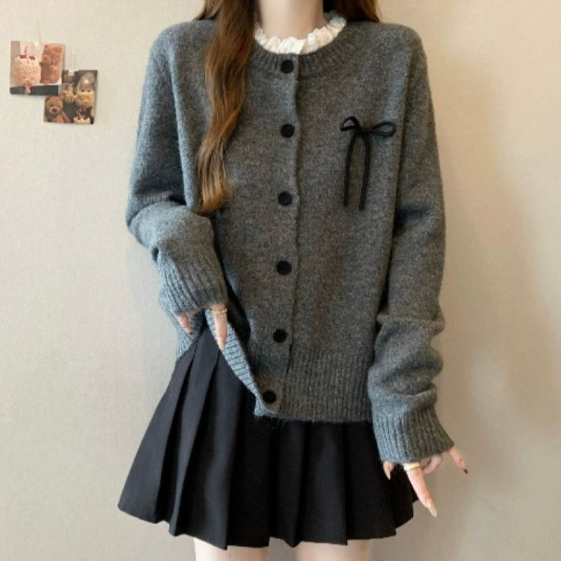Ladies comfortable cardigan with decorative buttons and chic knot accents