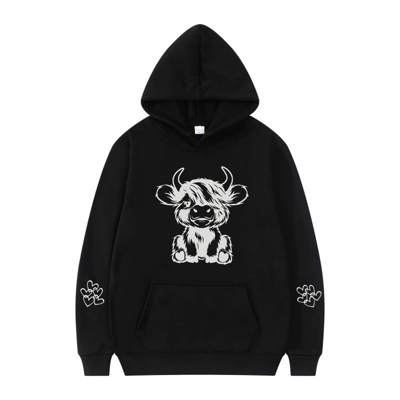 Women's hooded sweatshirt with charming cow motif and practical kangaroo pockets Lune London