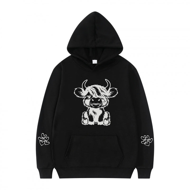 Women's hooded sweatshirt with charming cow motif and practical kangaroo pockets Lune London