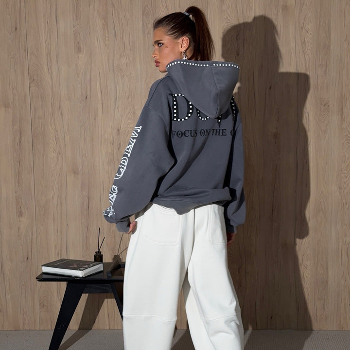 Ladies oversized hoodie with striking stone decoration and creative prints on the sleeves Lune London