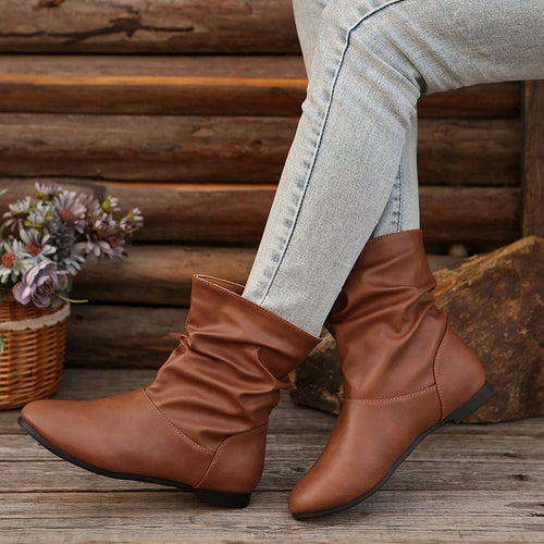 Fashionable women's ankle boots with an elegant ruffle design and a soft upper material Lune London