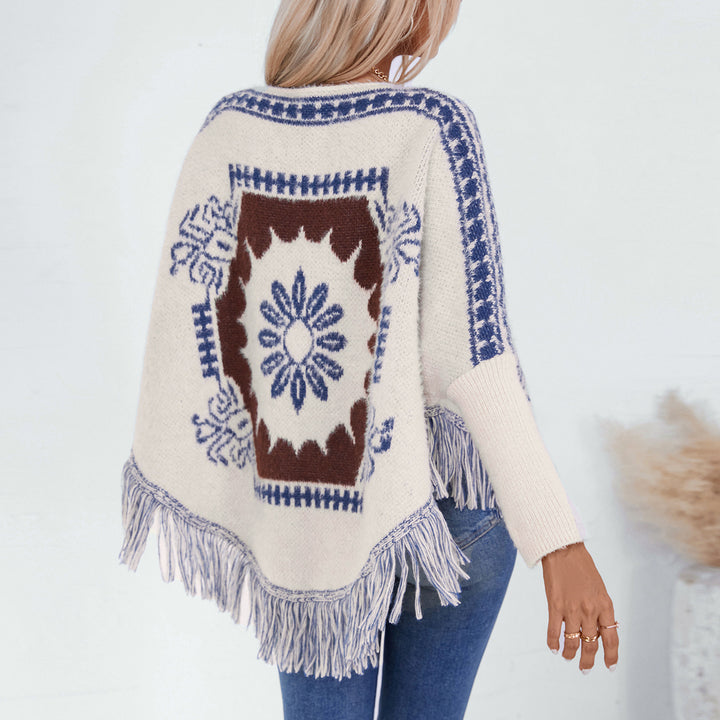 Ladies elegant knitted poncho with artistic pattern and fringe finish Lune London