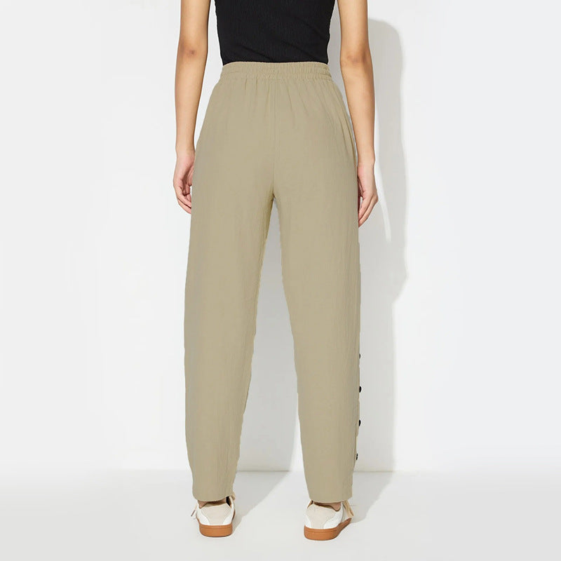 Women's fashionable jogger pants with decorative button details Chic & Stil