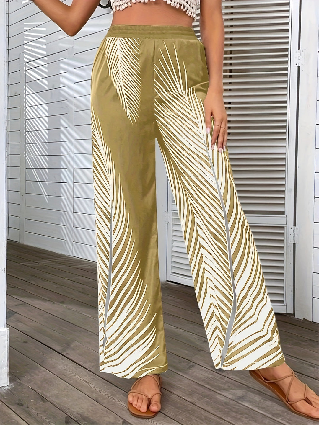 Elegant and lightweight palazzo pants for women with palm tree pattern Lune London