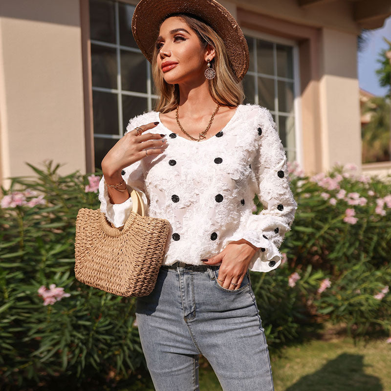 Tunique féminine à la mode avec un motif floral décoratif et des manches bouffantes Chic & Stil